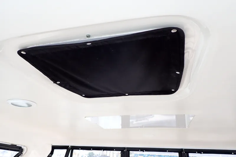 Slide: The Image of Ceiling view of 1998 Sea Ray 480 Sedan Bridge with black hatch cover. - 63
