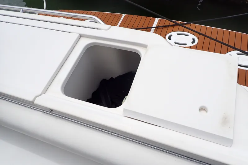 Slide: The Image of Open storage compartment on a 1998 Sea Ray 480 Sedan Bridge yacht deck. - 80