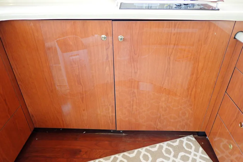 Slide: The Image of Wooden cabinetry in the 1998 Sea Ray 480 Sedan Bridge yacht interior. - 105