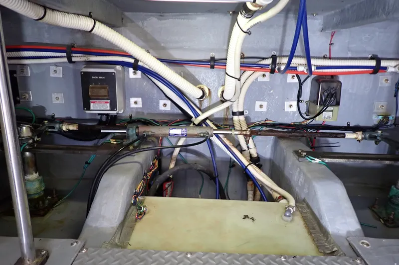 Slide: The Image of Engine room wiring and components of a 1998 Sea Ray 480 Sedan Bridge yacht. - 209
