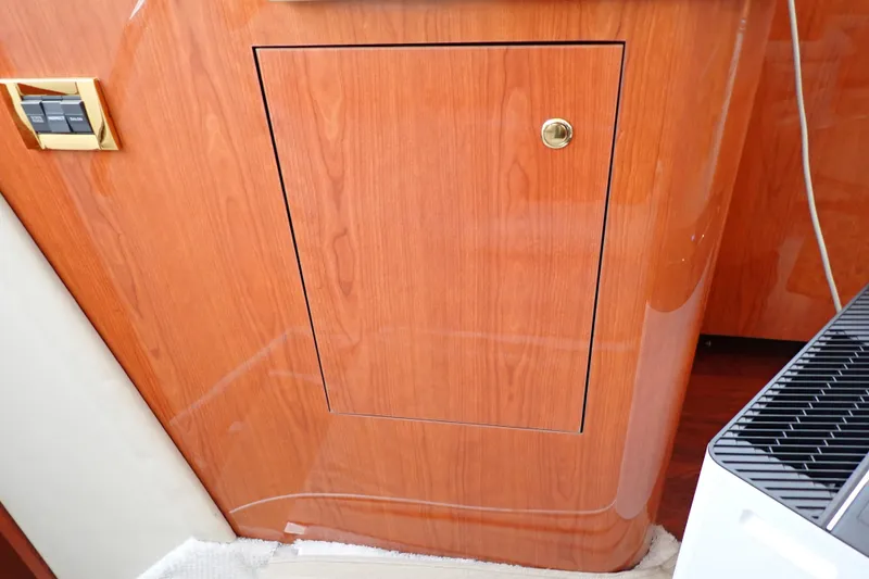 Slide: The Image of Wooden cabinet door on 1998 Sea Ray 480 Sedan Bridge yacht interior. - 133