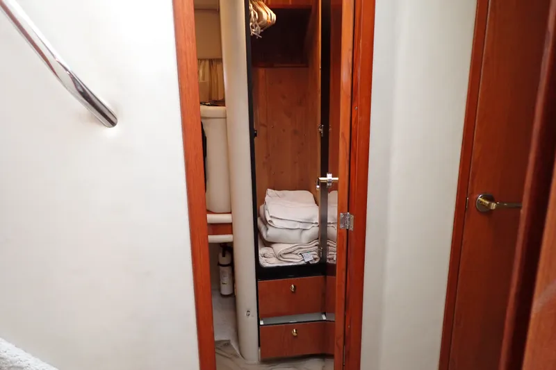 Slide: The Image of Interior view of 1998 Sea Ray 480 Sedan Bridge yacht cabin with wooden finishes. - 142