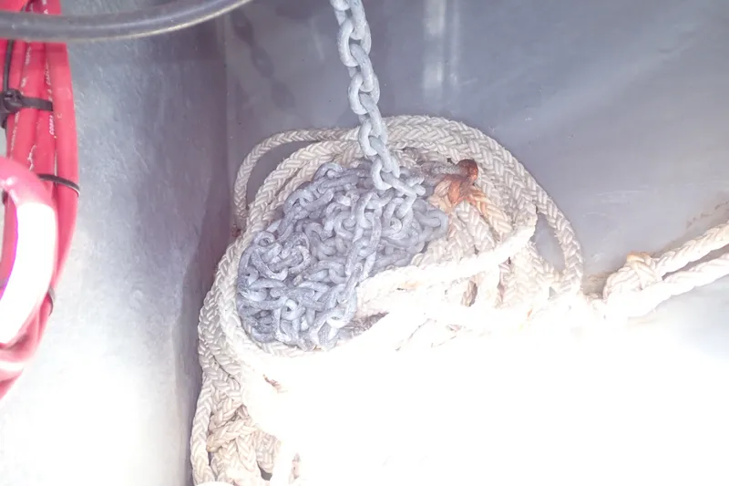Slide: The Image of Anchor chain and rope in a 1998 Sea Ray 480 Sedan Bridge boat compartment. - 97