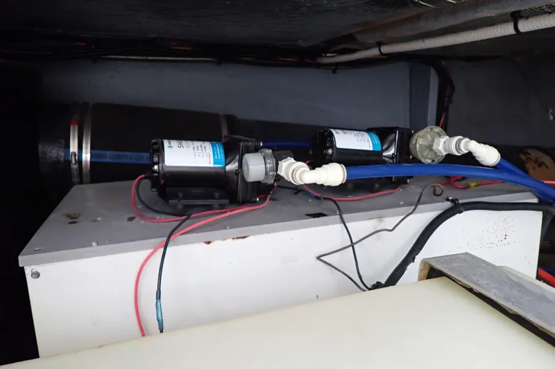 Slide: The Image of Engine compartment of a 1998 Sea Ray 480 Sedan Bridge with visible wiring and components. - 207