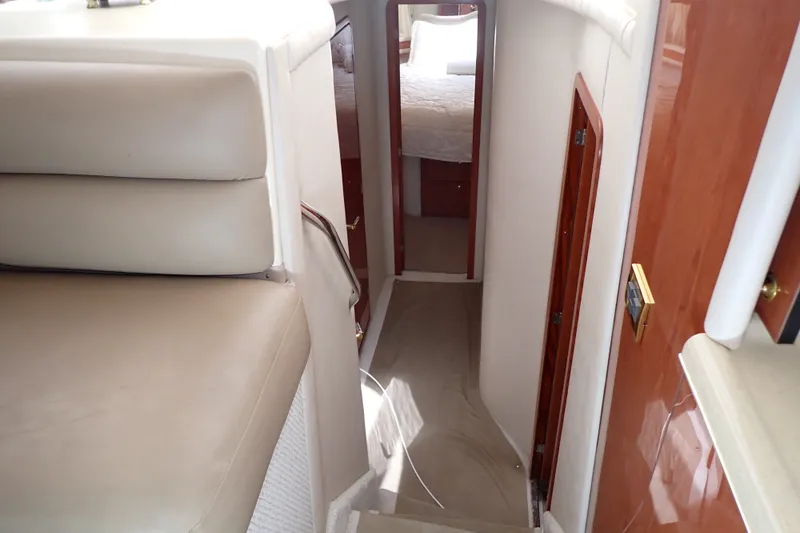 Slide: The Image of Interior view of 1998 Sea Ray 480 Sedan Bridge yacht, featuring a cozy hallway and cabin. - 20