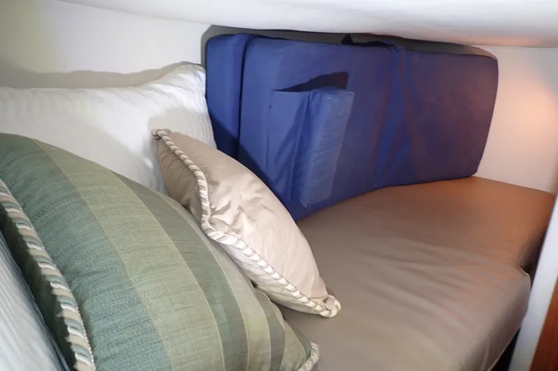 Slide: The Image of Cozy cabin bed with pillows on 1998 Sea Ray 480 Sedan Bridge yacht. - 22