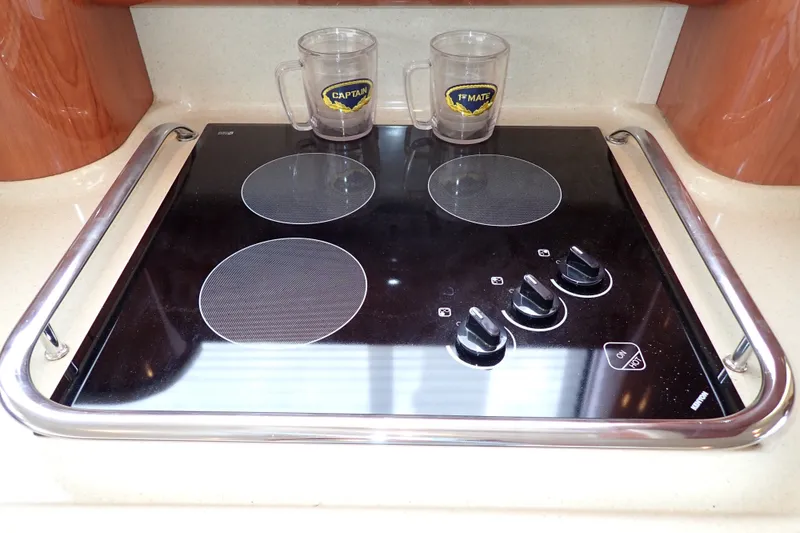 Slide: The Image of Electric stovetop with four burners on a 1998 Sea Ray 480 Sedan Bridge yacht. - 100
