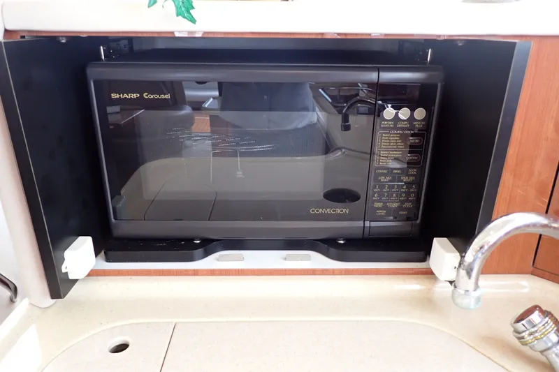 Slide: The Image of Sharp Carousel convection microwave in 1998 Sea Ray 480 Sedan Bridge kitchen. - 101