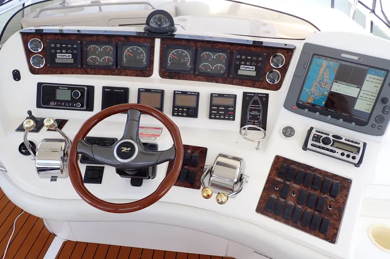 Slide: The Image of Control panel of a 1998 Sea Ray 480 Sedan Bridge yacht with navigation instruments. - 10