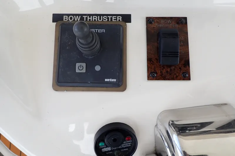 Slide: The Image of Control panel of a 1998 Sea Ray 480 Sedan Bridge with bow thruster joystick. - 53