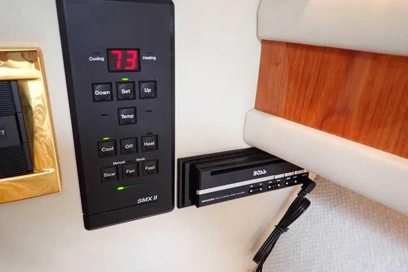 Slide: The Image of Control panel and multimedia player on a 1998 Sea Ray 480 Sedan Bridge yacht. - 166