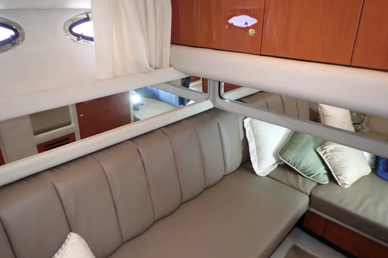 Slide: The Image of Luxurious interior of 1998 Sea Ray 480 Sedan Bridge with plush seating and elegant decor. - 21