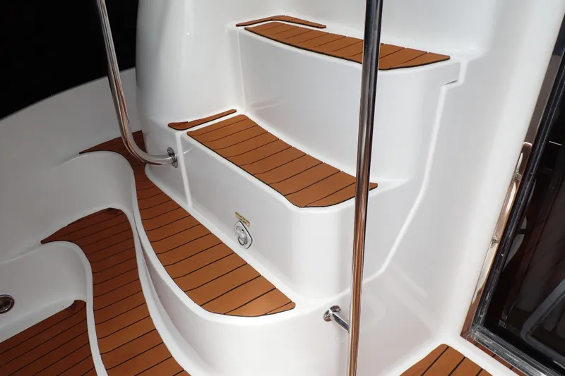 Slide: The Image of Staircase on 1998 Sea Ray 480 Sedan Bridge yacht with teak-style steps. - 71