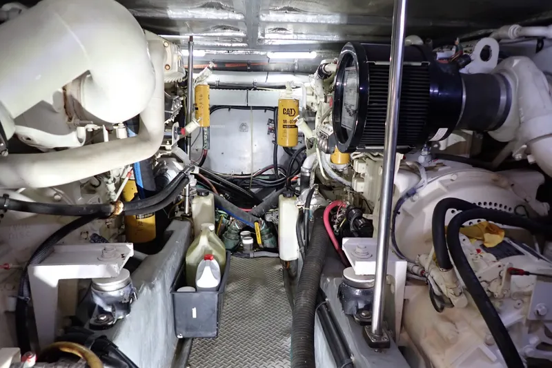 Slide: The Image of Engine room of a 1998 Sea Ray 480 Sedan Bridge yacht, showcasing mechanical components. - 190