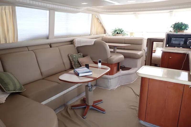Slide: The Image of Luxurious interior of a 1998 Sea Ray 480 Sedan Bridge yacht with plush seating and modern amenities. - 14