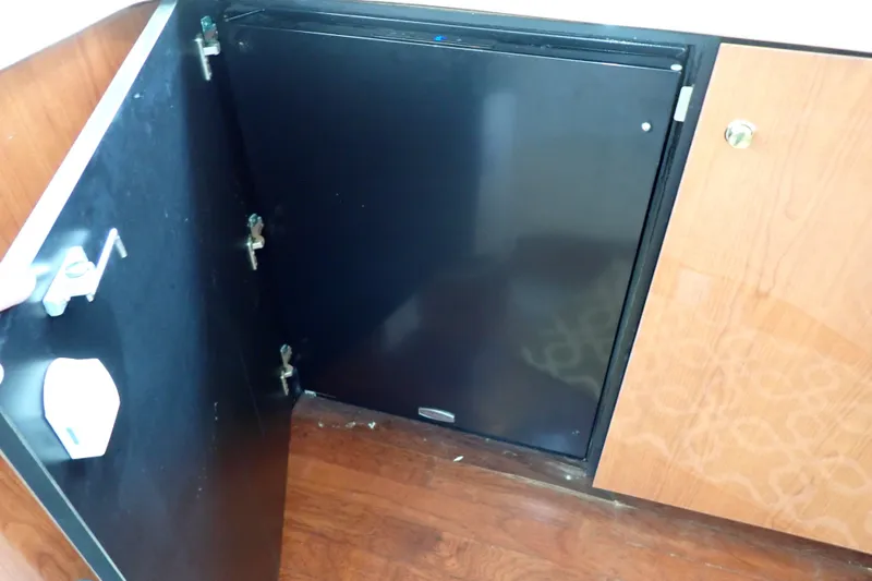Slide: The Image of Open cabinet door on 1998 Sea Ray 480 Sedan Bridge yacht interior. - 106