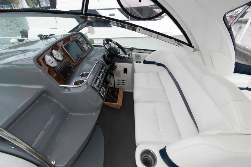 Slide: The Image of Interior of a 2014 Formula 40 Performance Cruiser with white seating and modern dashboard. - 7