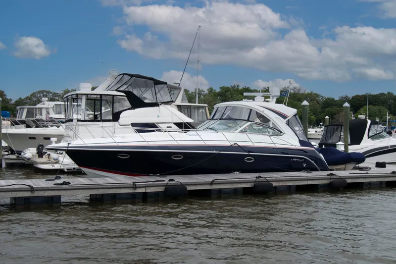 The Image of 2014 Formula 40 Performance Cruiser docked at marina under blue sky. - 0