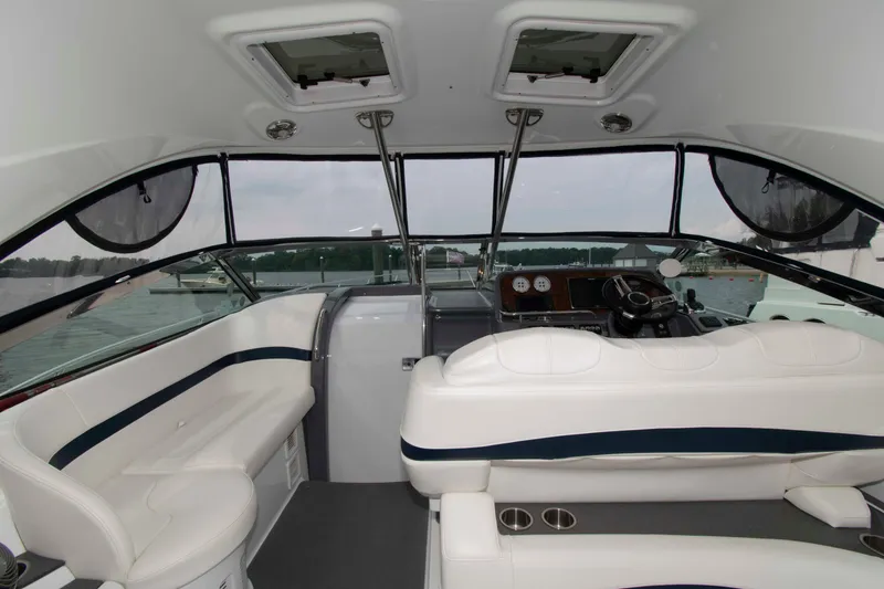 Slide: The Image of Interior of a 2014 Formula 40 Performance Cruiser with white seating and helm. - 6