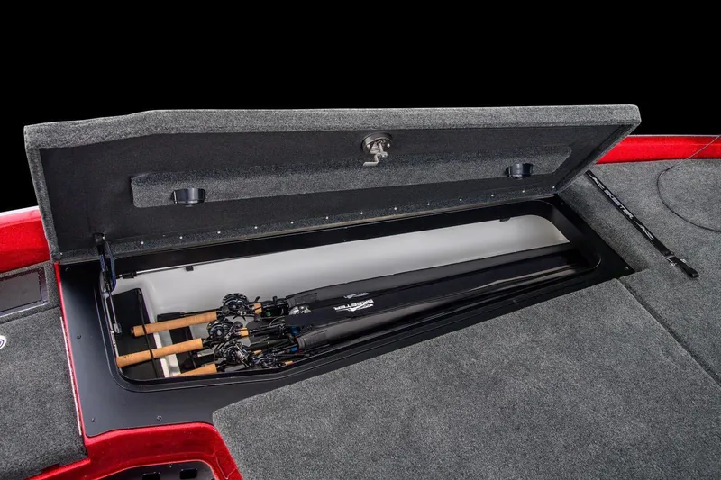 Slide: The Image of Manufacturer Provided Image: 2022 Skeeter FXR 21 boat rod storage compartment with fishing rods. - 18