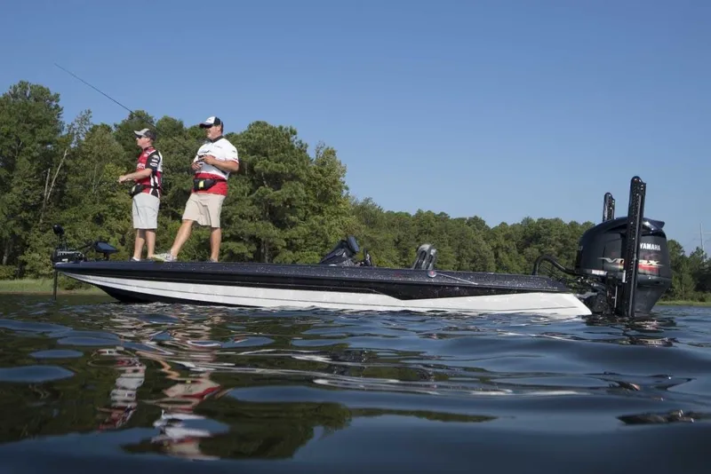 Slide: The Image of Manufacturer Provided Image: 2022 Skeeter FXR 21 boat with two anglers fishing on a lake. - 16