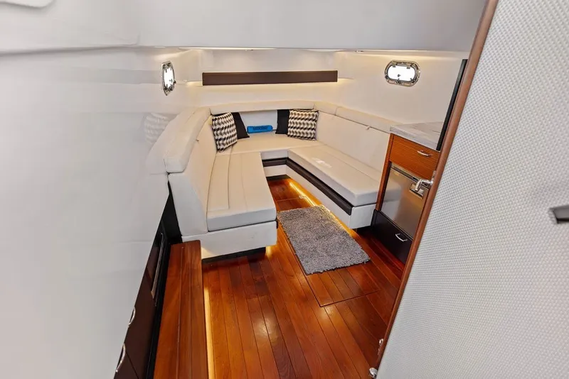 Slide: The Image of Luxurious interior of 2020 Pursuit S 408 Sport boat with elegant seating and wood flooring. - 52