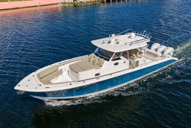 Slide: The Image of 2020 Pursuit S 408 Sport boat cruising on blue water. - 7