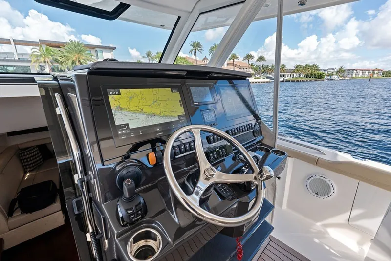 Slide: The Image of Helm of 2020 Pursuit S 408 Sport boat with advanced navigation displays. - 33