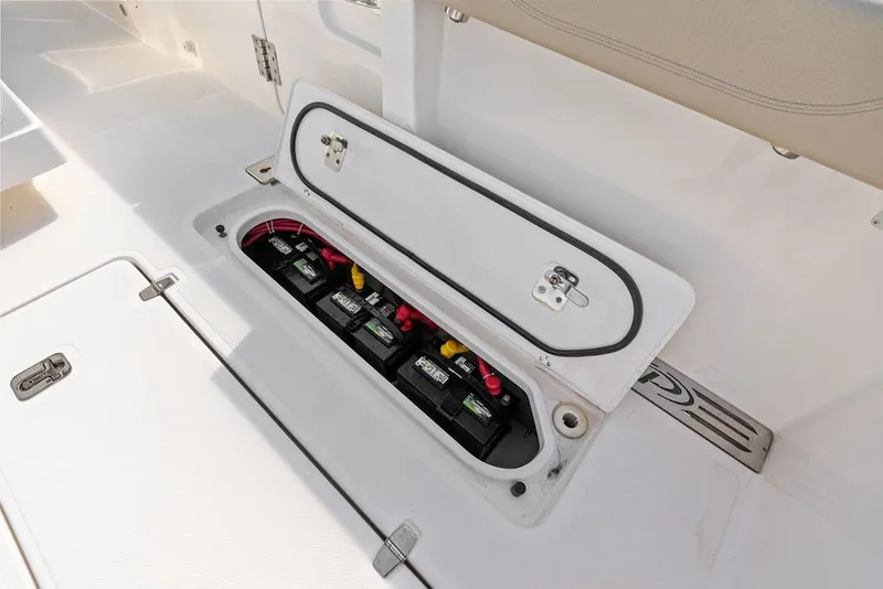 Slide: The Image of Battery compartment of a 2020 Pursuit S 408 Sport boat, showcasing multiple batteries. - 26