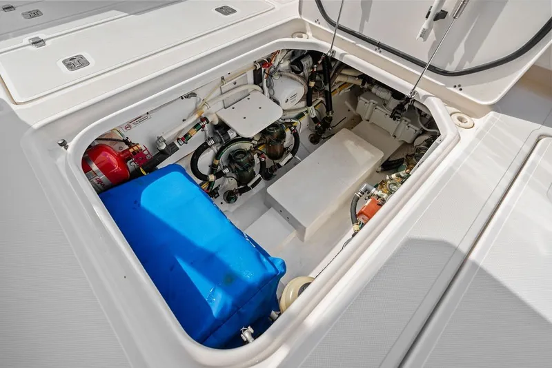 Slide: The Image of Engine compartment of a 2020 Pursuit S 408 Sport boat, showcasing internal components. - 47