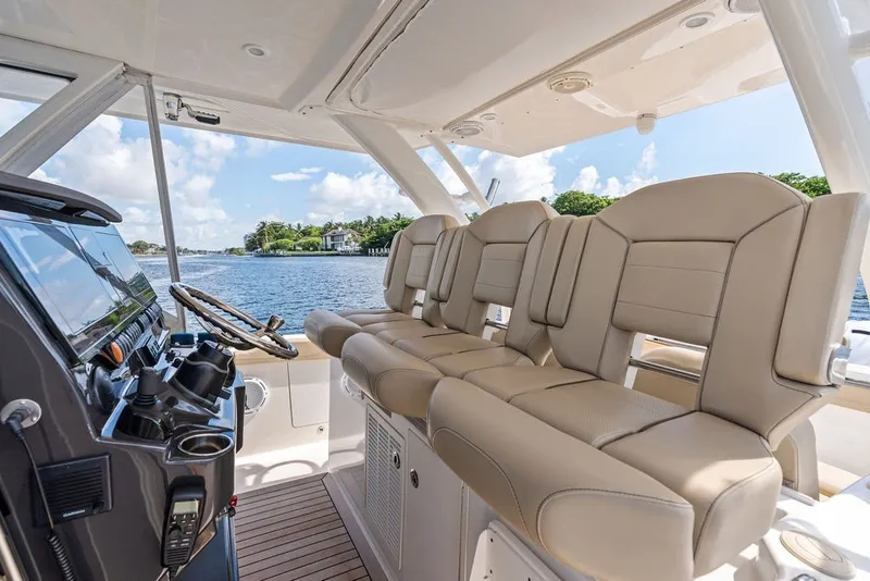Slide: The Image of Interior of 2020 Pursuit S 408 Sport boat with luxurious seating and scenic water view. - 29