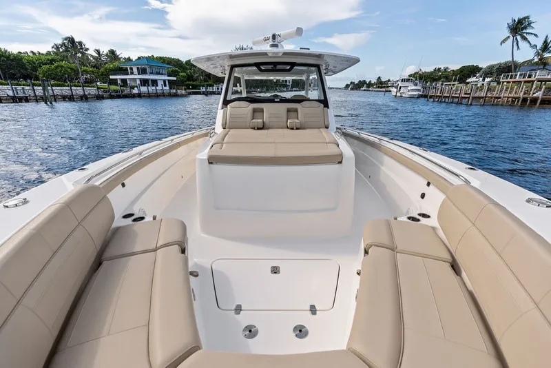 Slide: The Image of 2020 Pursuit S 408 Sport boat with spacious seating on a calm waterway. - 43