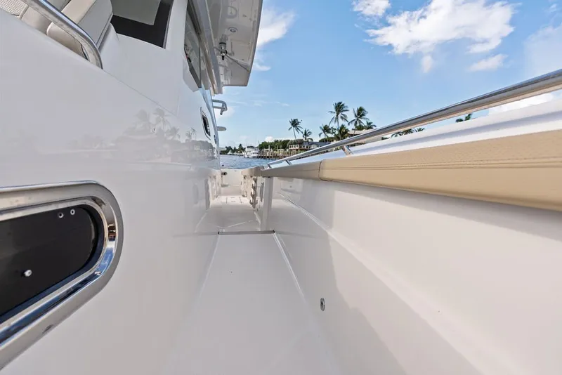 Slide: The Image of 2020 Pursuit S 408 Sport boat deck with sleek design and ocean view. - 46