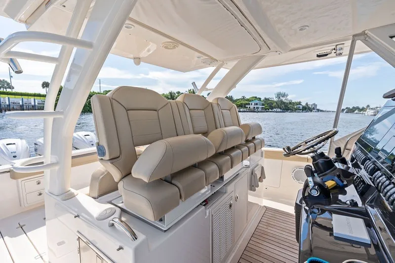 Slide: The Image of Luxurious interior of 2020 Pursuit S 408 Sport boat with plush seating and modern controls. - 30