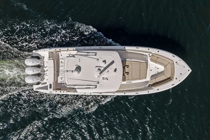 Slide: The Image of Aerial view of 2020 Pursuit S 408 Sport boat cruising on water. - 2