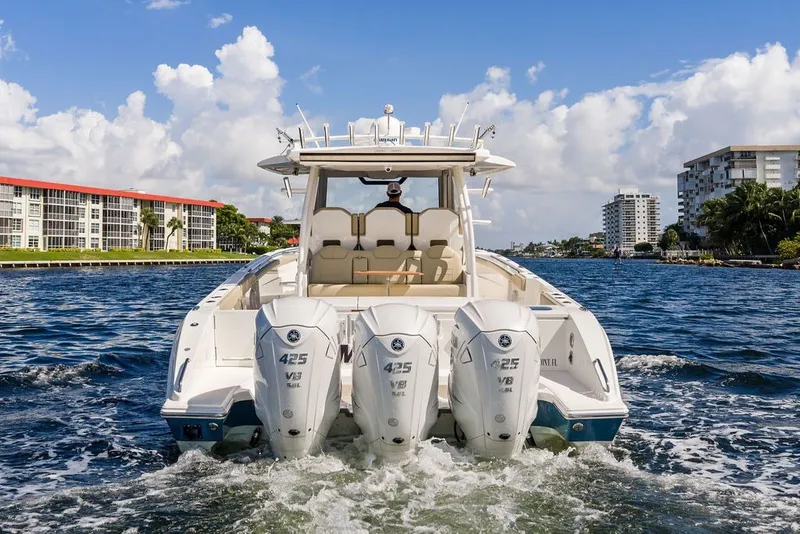 Slide: The Image of 2020 Pursuit S 408 Sport boat cruising on a sunny day with powerful engines. - 11