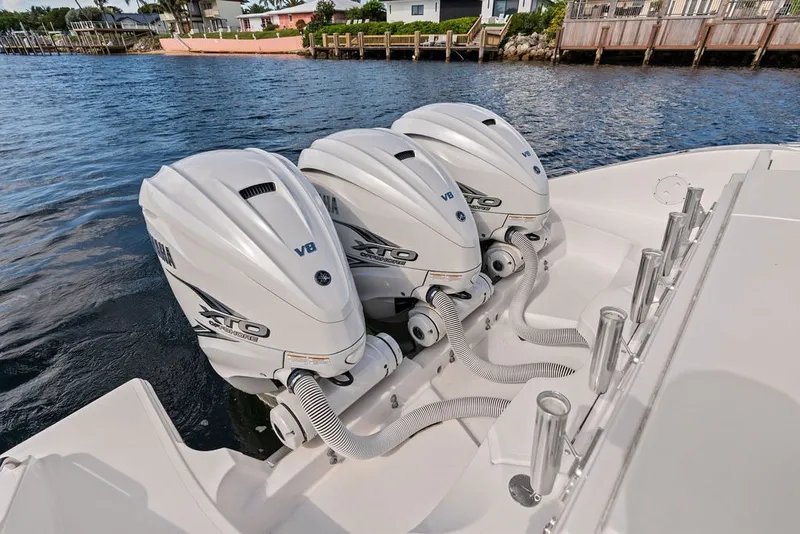Slide: The Image of Triple Yamaha V8 outboard engines on a 2020 Pursuit S 408 Sport boat. - 15