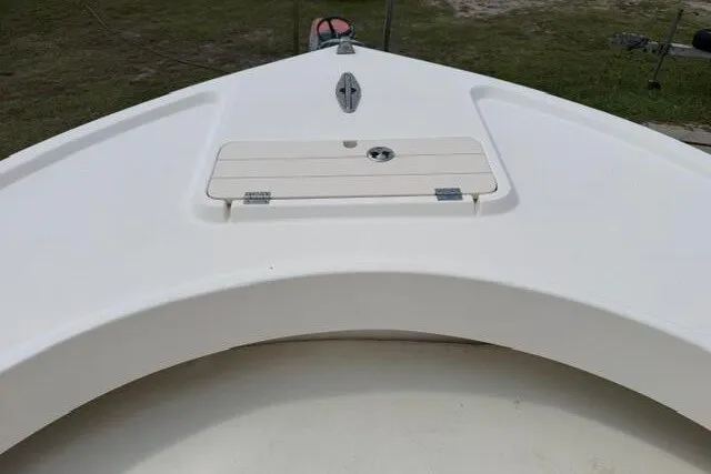 Slide: The Image of Bow of a 2006 Parker 2100 Special Edition boat, featuring a sleek white design. - 10