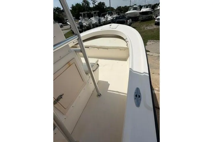 Slide: The Image of 2006 Parker 2100 Special Edition boat, spacious deck, docked among other boats. - 25