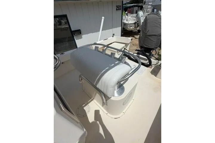 Slide: The Image of 2006 Parker 2100 Special Edition boat interior with white seating and metal railings. - 15