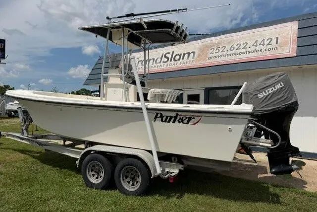 Slide: The Image of 2006 Parker 2100 Special Edition boat on trailer, parked outside dealership. - 1