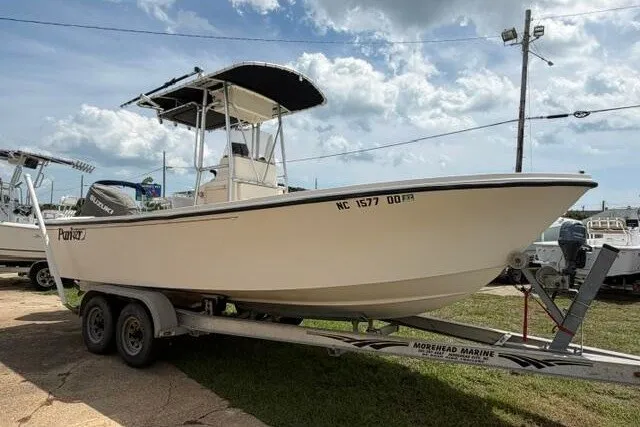 The Image of 2006 Parker 2100 Special Edition boat on trailer under cloudy sky. - 0