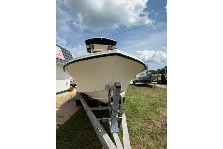 Slide: The Image of 2006 Parker 2100 Special Edition boat on trailer under cloudy sky. - 8
