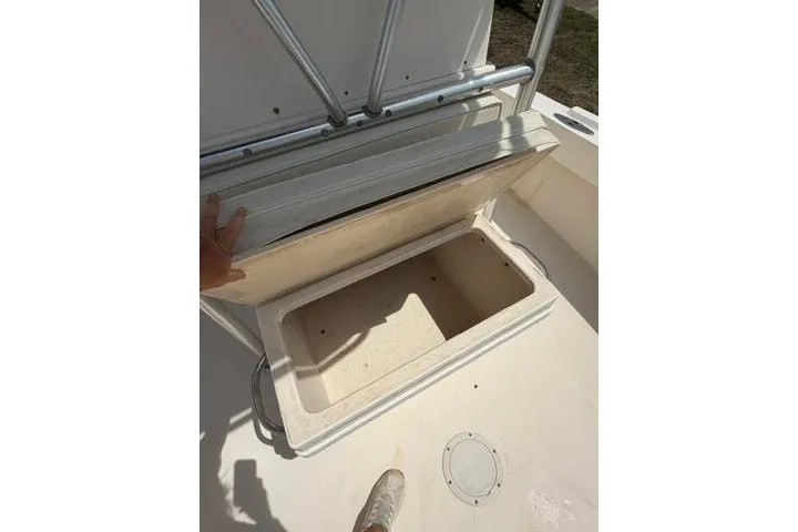 Slide: The Image of Open storage compartment on a 2006 Parker 2100 Special Edition boat deck. - 12