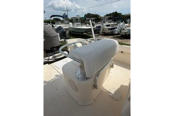 Slide: The Image of 2006 Parker 2100 Special Edition boat with white seating, docked at a marina. - 19