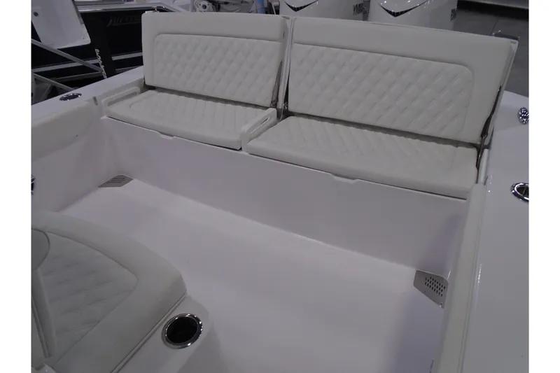 Slide: The Image of Luxurious seating on the 2027 Striking Boats 27XB, featuring quilted white upholstery. - 33