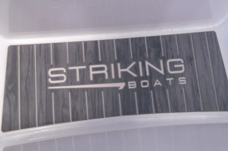 Slide: The Image of Striking Boats 27XB 2027 model logo on textured surface. - 15
