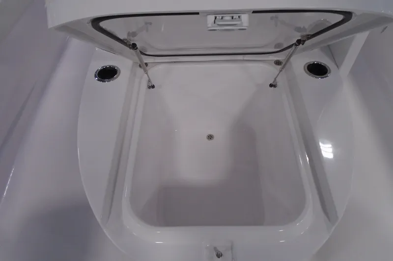 Slide: The Image of Open storage compartment on 2027 Striking Boats 27XB, showcasing interior design. - 25