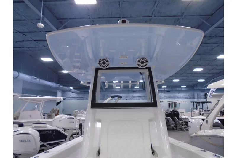 Slide: The Image of 2027 Striking Boats 27XB model in showroom, featuring sleek design and modern amenities. - 19