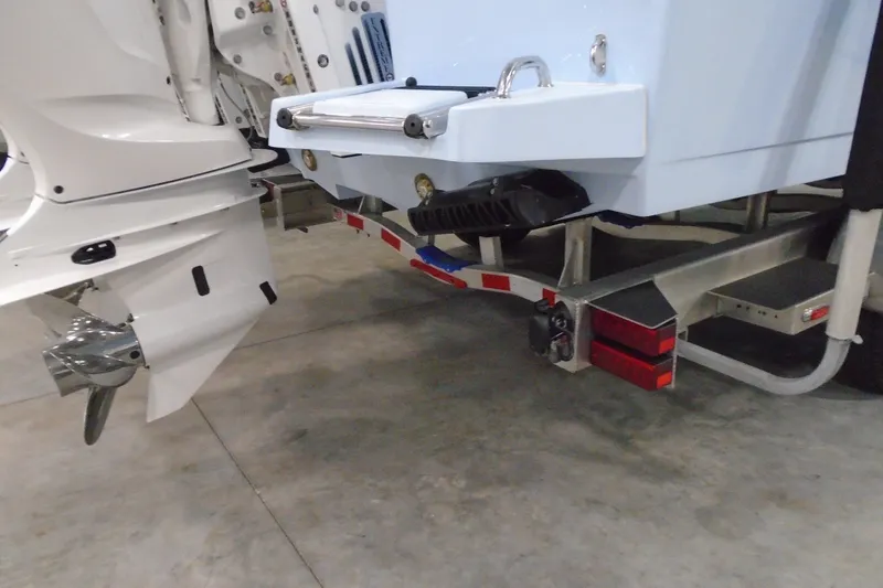 Slide: The Image of Rear view of a 2027 Striking Boats 27XB on a trailer in a garage. - 35
